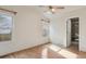 Spacious bedroom with hardwood floors and ceiling fan at 7139 Pine Hills Way, Littleton, CO 80125