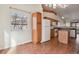 Kitchen and dining area with wood flooring and ample natural light at 7139 Pine Hills Way, Littleton, CO 80125