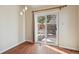 Bright dining area with sliding door access to backyard patio at 7139 Pine Hills Way, Littleton, CO 80125