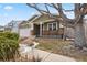 House exterior showcasing a tree and landscaping at 7139 Pine Hills Way, Littleton, CO 80125