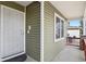 Front door with security screen and sidelights at 7139 Pine Hills Way, Littleton, CO 80125