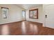 Living room with hardwood floors and window shutters at 7139 Pine Hills Way, Littleton, CO 80125