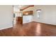 Open living area with hardwood floors and kitchen view at 7139 Pine Hills Way, Littleton, CO 80125