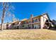 Townhome featuring a backyard patio at 2601 S Quebec St # 6, Denver, CO 80231