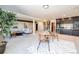Expansive basement living area with bar, seating, and stairs to the main level at 2601 S Quebec St # 6, Denver, CO 80231