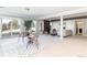 Large basement with living area, fireplace, and sliding glass doors to the backyard at 2601 S Quebec St # 6, Denver, CO 80231