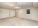 Large bedroom with double closets, neutral carpet, and natural light at 2601 S Quebec St # 6, Denver, CO 80231