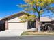 Charming single-story home featuring a two-car garage, mature tree, and a welcoming covered front porch at 2601 S Quebec St # 6, Denver, CO 80231