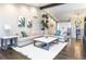 Spacious living room filled with natural light, showcasing modern decor and ample seating for entertaining at 2601 S Quebec St # 6, Denver, CO 80231