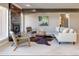 Cozy living room with modern fireplace, comfortable seating, and ample natural light at 2601 S Quebec St # 6, Denver, CO 80231