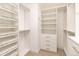 A well-organized walk-in closet with adjustable shelving and drawers for efficient storage solutions at 2601 S Quebec St # 6, Denver, CO 80231