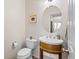 Half bath featuring stylish sink and light fixtures at 8335 Deframe Ct, Arvada, CO 80005