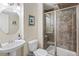 Contemporary bathroom featuring decorative vessel sink and walk-in shower with decorative tile at 8335 Deframe Ct, Arvada, CO 80005