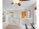 Hallway with carpet, white railing and natural light at 8335 Deframe Ct, Arvada, CO 80005