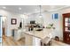 Well lit kitchen featuring granite counters, kitchen island and light wood floors at 8335 Deframe Ct, Arvada, CO 80005