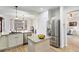 Kitchen with a view to the living room, featuring stainless appliances and granite counters at 8335 Deframe Ct, Arvada, CO 80005