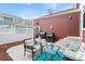 Back patio features an outdoor seating area and two BBQ grills for cooking at 8335 Deframe Ct, Arvada, CO 80005