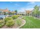 Community pool area with shaded seating and well-manicured landscape at 8335 Deframe Ct, Arvada, CO 80005