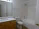 Bathroom featuring white tile, a shower and tub combo, and a modern vanity at 3271 E 103Rd Pl # 1307, Thornton, CO 80229