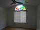 Bedroom with a stained glass window, wood floors and natural light at 3271 E 103Rd Pl # 1307, Thornton, CO 80229