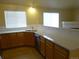 Bright kitchen with wood cabinets, stainless steel appliances and modern countertops at 3271 E 103Rd Pl # 1307, Thornton, CO 80229