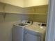 Laundry room with newer model washing machine and dryer, and wire shelving at 3271 E 103Rd Pl # 1307, Thornton, CO 80229