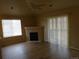 Living room featuring a fireplace, wood floors, and lots of natural light at 3271 E 103Rd Pl # 1307, Thornton, CO 80229