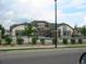 Community clubhouse featuring a pool, landscaping and walking path in front at 3271 E 103Rd Pl # 1307, Thornton, CO 80229