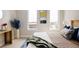 Bedroom featuring natural lighting from dual windows and decor at 8280 E 36Th Ave # 26, Denver, CO 80238