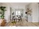 Open dining area with a modern table, chairs, and view of the kitchen and bar area at 8280 E 36Th Ave # 26, Denver, CO 80238