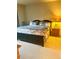 A well-lit primary bedroom with a large comfortable bed and a stylish nightstand at 12604 Madison Way, Thornton, CO 80241
