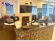 Cozy living room features a fireplace, a large TV, and comfortable seating at 12604 Madison Way, Thornton, CO 80241