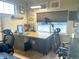 Well-lit office space with multiple workstations and views of the outdoors at 12604 Madison Way, Thornton, CO 80241