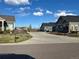 Street view of the community featuring single Gathering homes and a well maintained parking area at 12604 Madison Way, Thornton, CO 80241