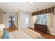 Bright bedroom with wood floors, double closet, and window coverings at 8182 S Winnipeg Ct, Aurora, CO 80016