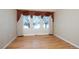 Well-lit bedroom with hardwood floors and large windows at 8182 S Winnipeg Ct, Aurora, CO 80016