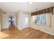 Bedroom with wood floors, double closet, and window with view at 8182 S Winnipeg Ct, Aurora, CO 80016