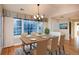 Dining room with hardwood floors and large windows at 8182 S Winnipeg Ct, Aurora, CO 80016