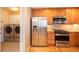 Kitchen features stainless steel appliances and laundry closet at 8182 S Winnipeg Ct, Aurora, CO 80016