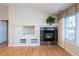 Living room featuring a fireplace and built-in shelving at 8182 S Winnipeg Ct, Aurora, CO 80016