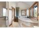 Elegant bathroom featuring a glass shower, soaking tub, and wooden accents for a relaxing ambiance at 23 Verde Ct, Breckenridge, CO 80424