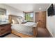 Comfortable bedroom featuring a large window view, and closet with rustic wood doors at 23 Verde Ct, Breckenridge, CO 80424