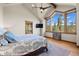 Vaulted bedroom with beamed ceiling, large windows and mountain views at 23 Verde Ct, Breckenridge, CO 80424