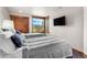 Bright bedroom featuring two twin beds, wood accents and a beautiful outdoor view at 23 Verde Ct, Breckenridge, CO 80424