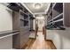 Spacious walk-in closet with custom shelving and hardwood floors at 23 Verde Ct, Breckenridge, CO 80424