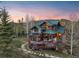 Charming mountain home featuring a walk-out deck and beautiful stone walkway at 23 Verde Ct, Breckenridge, CO 80424