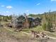 Beautiful mountain home featuring a stone chimney, walk-out deck and backyard fire pit at 23 Verde Ct, Breckenridge, CO 80424