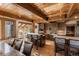 Gourmet kitchen featuring wooden cabinets, stainless steel appliances, a breakfast bar, and views of the breakfast nook at 23 Verde Ct, Breckenridge, CO 80424