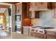 Close-up of kitchen appliances featuring a stainless steel Wolf range and modern cabinetry at 23 Verde Ct, Breckenridge, CO 80424