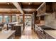 Modern kitchen featuring wooden cabinets, stainless steel appliances, and a view into the breakfast nook at 23 Verde Ct, Breckenridge, CO 80424